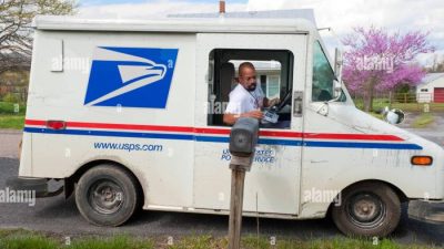Postwoman alamy stock mail sorting letters royal round her bags